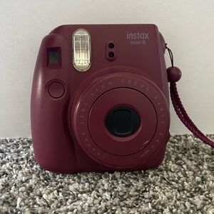 Purple Polaroid Camera, has some scratches however it works perfect!